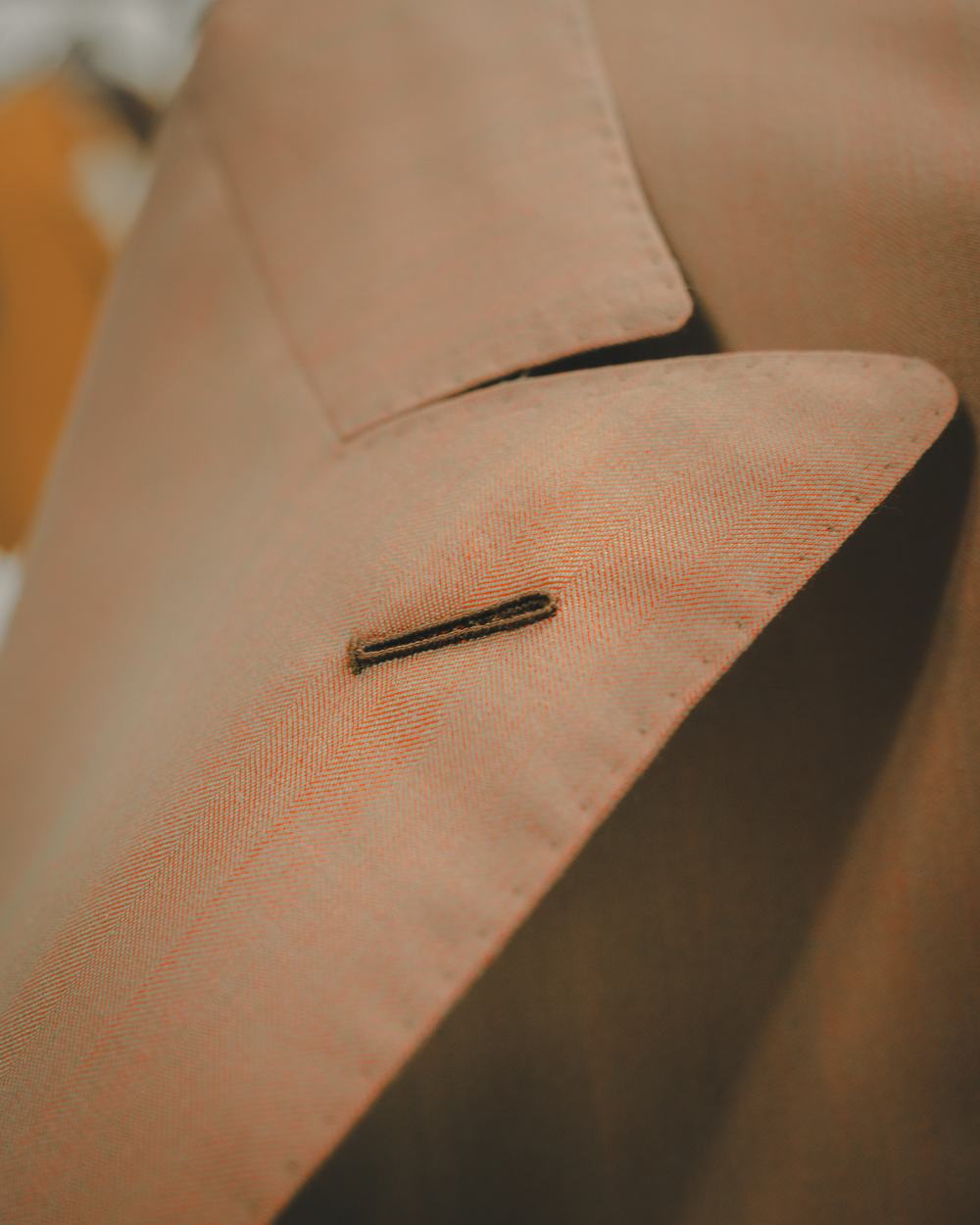 Close-up of a hand-finished lapel buttonhole